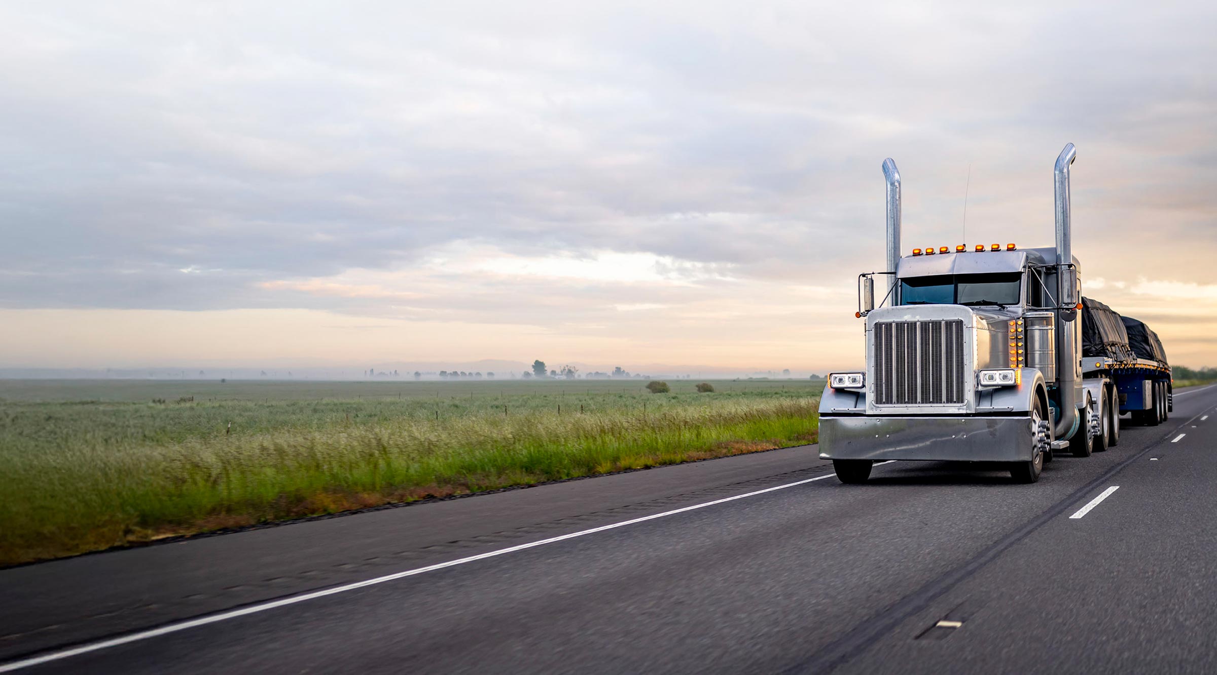 Flatbed Truck Hauling a Load on the Open Road